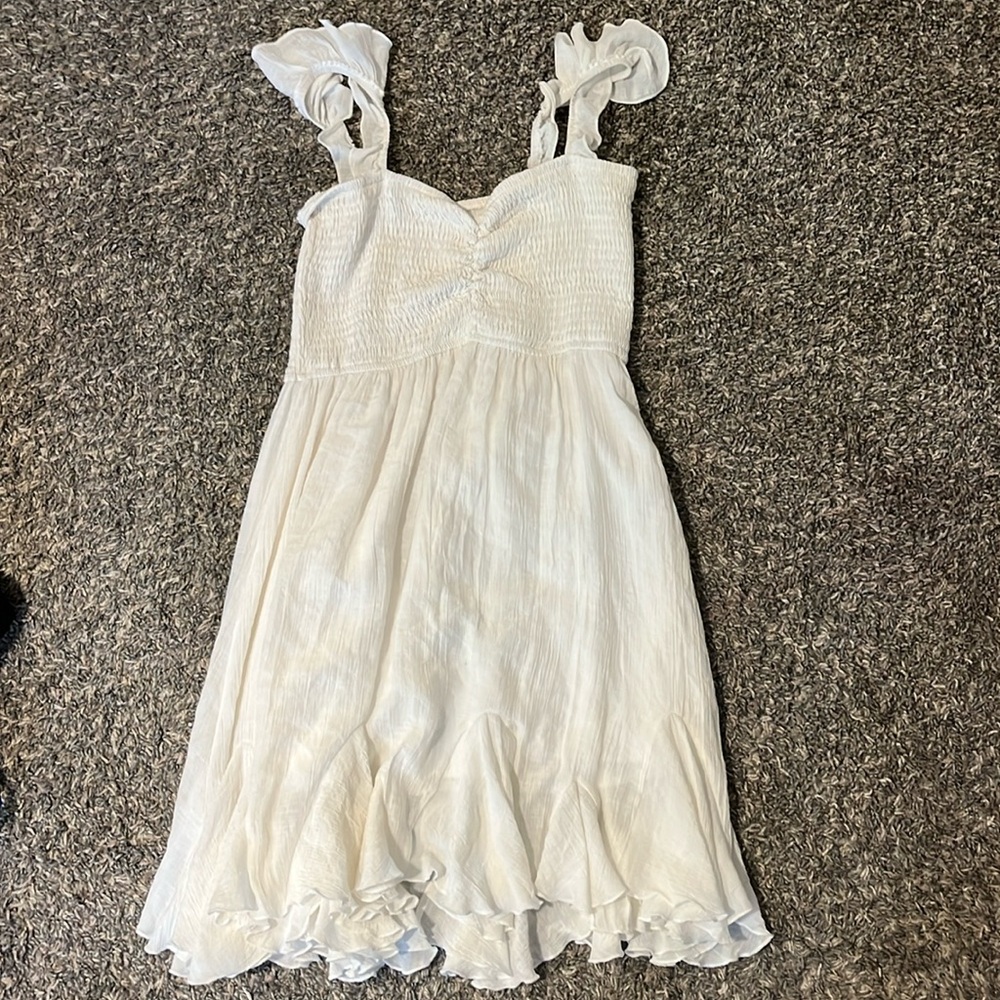 White dress that feels like linen, ruffle sleeves, and flowy